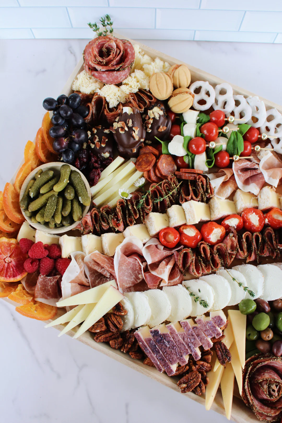 Blossom and Brie signature dishes Customizable Charcuterie and Cheese Boards, The Brie & Apple Sandwich, Caprese Sandwich, Avocado Toast